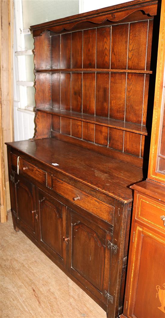 Oak dresser, fitted open shelves, two short drawers and a pair of panelled doors(-)